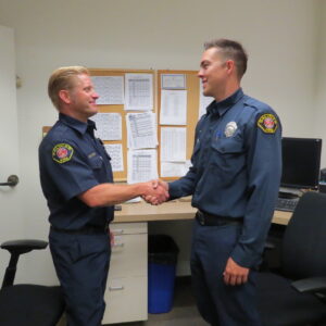 image of two officers shaking hands